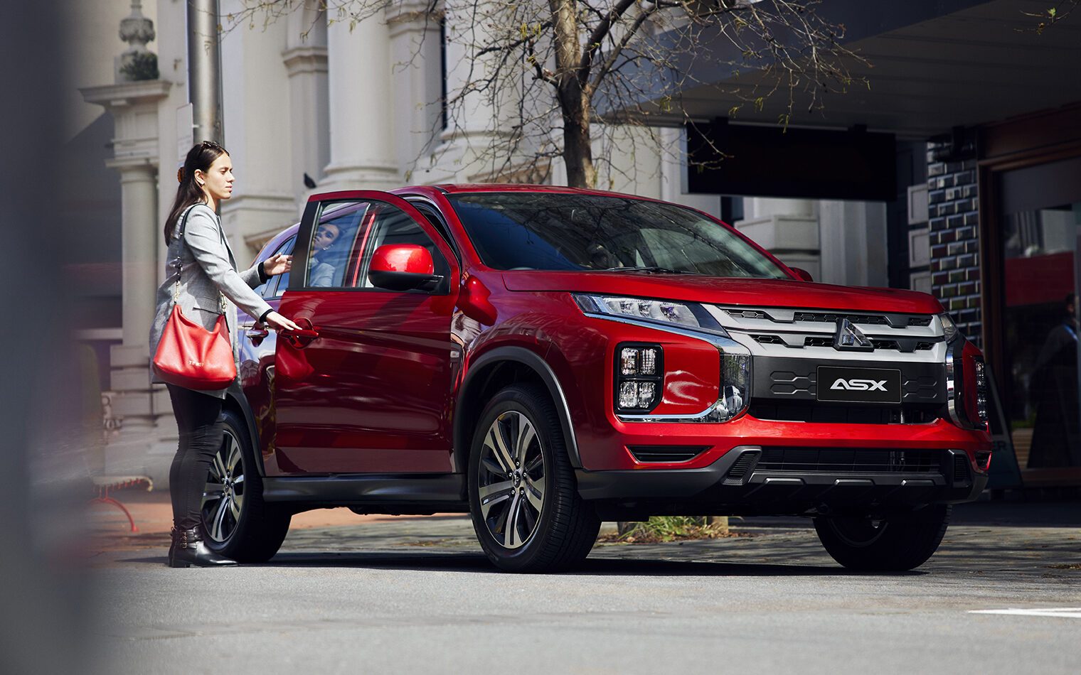 Mitsubishi ASX with woman opening door