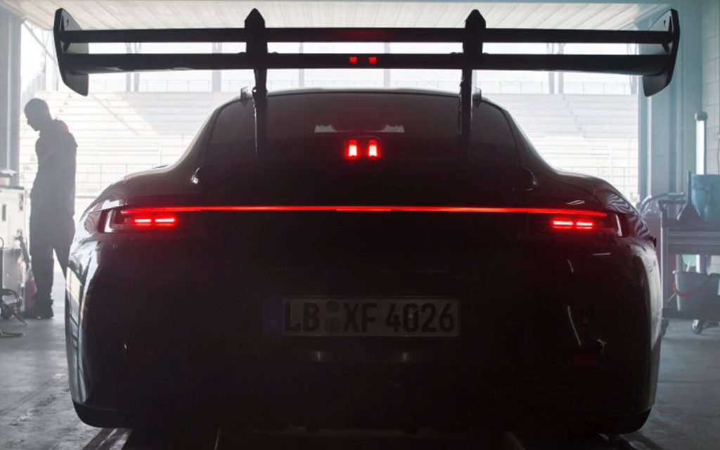 Porsche 911 992 GT3 RS rear in pit garage