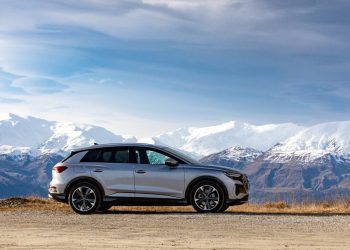 Audi Q4 e-tron side view with mountains in distance