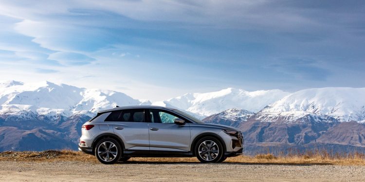 Audi Q4 e-tron side view with mountains in distance