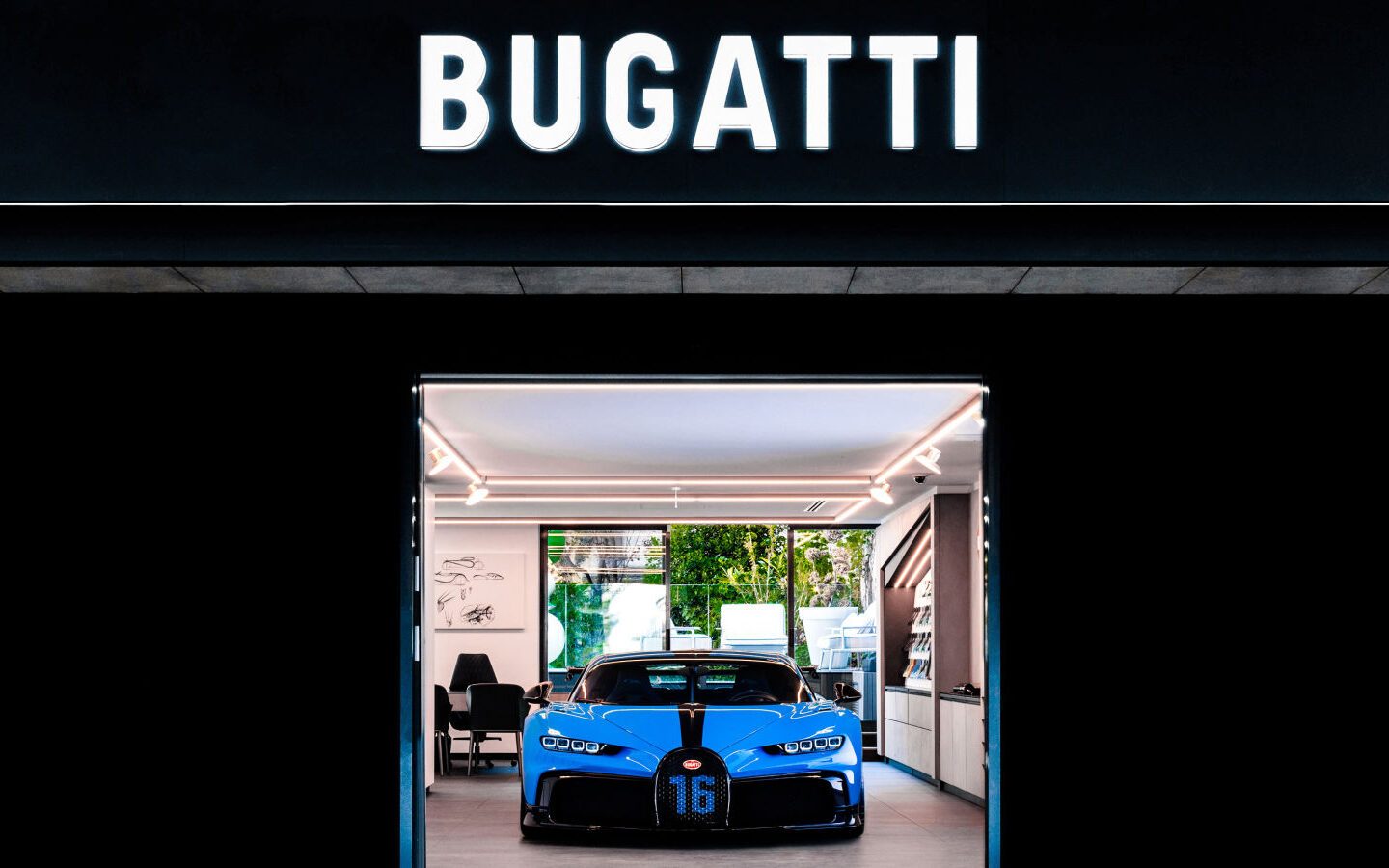 Bugatti Chiron inside showroom under logo
