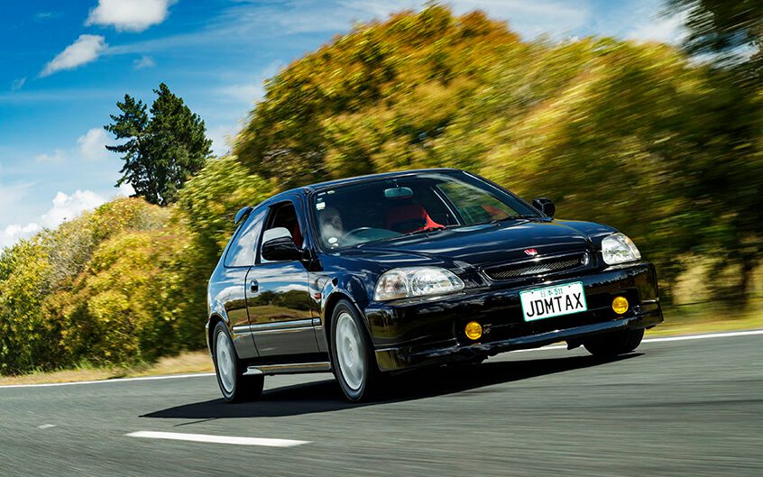 Honda Civic Type R EK9 front three quarter view driving on road