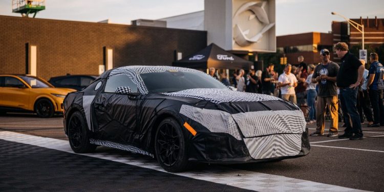 Seventh-generation Ford Mustang under camouflage front three quarter view