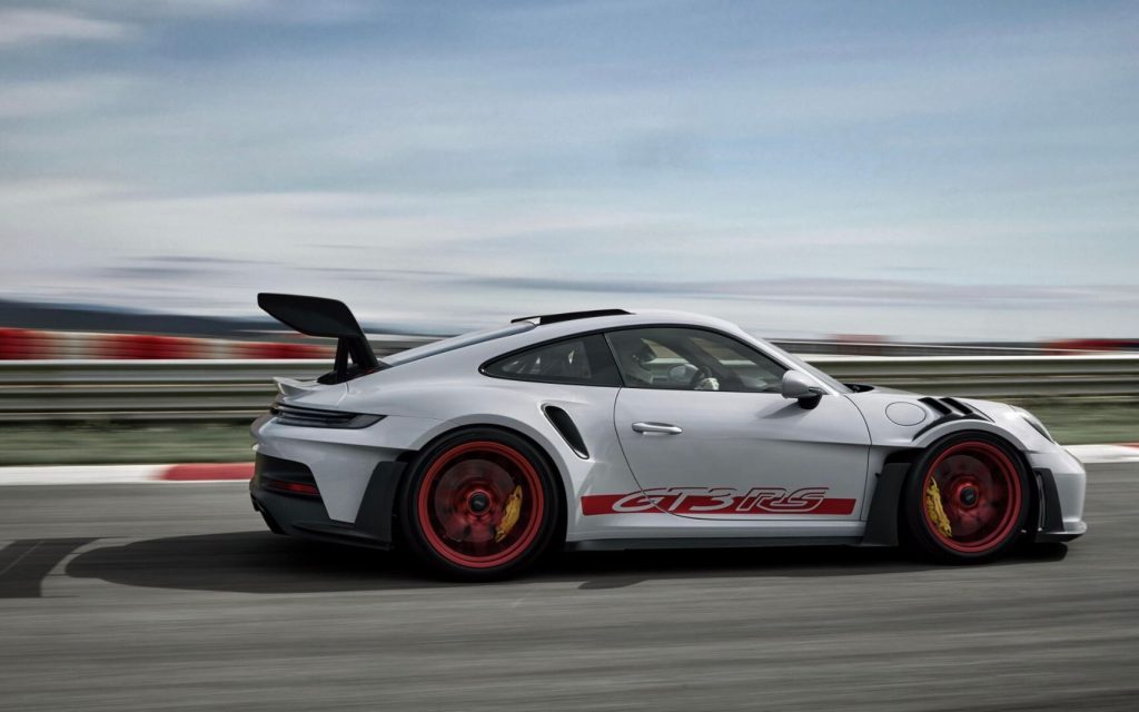 Porsche 911 GT3 RS 992-generation side view driving on track