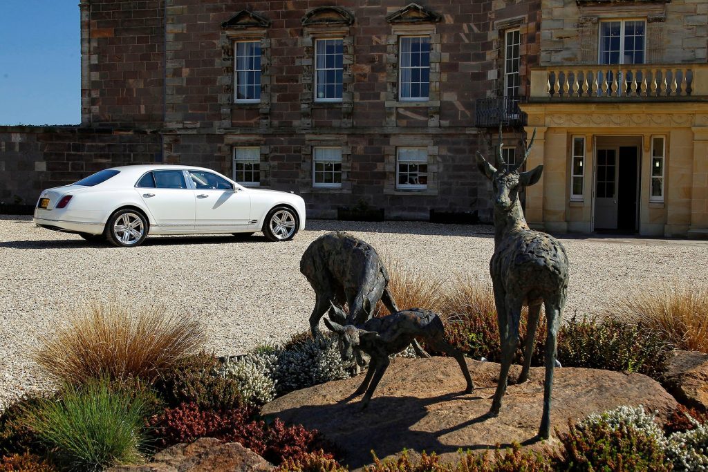 2010 Bentley Mulsanne parked in front of stately building