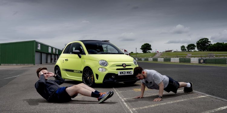 Abarth front three quarter view with people working out in front