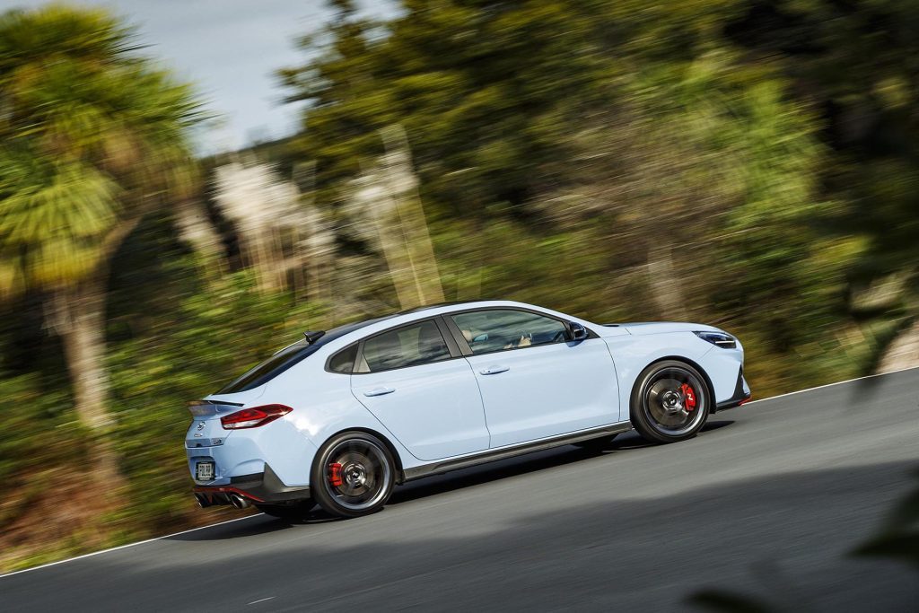 2022 Hyundai i30 N Fastback DCT driving past trees