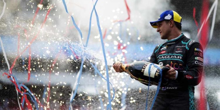 Mitch Evans spraying champagne on Formula E podium