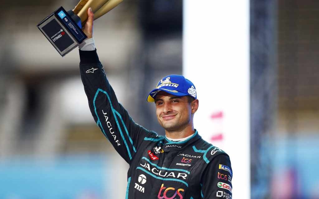 Mitch Evans holding up Formula E trophy