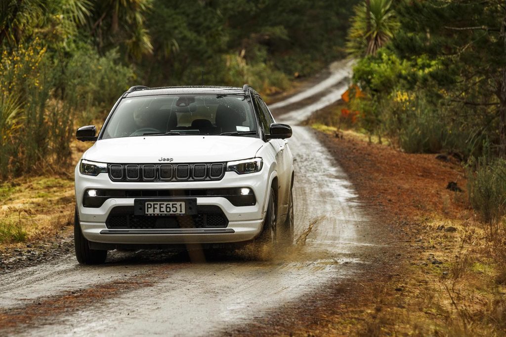 2022 Jeep Compass S-Limited driving down forestry road