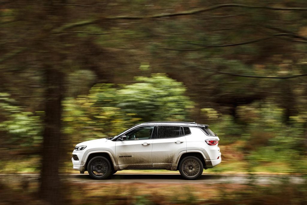 2022 Jeep Compass S-Limited driving through forest