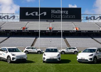 Kia Niro EVs in stadium in front of Halberg Foundation sign