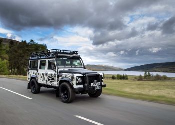 Land Rover Defender Works V8 Trophy II front three quarters driving on road