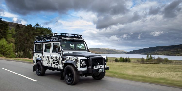 Land Rover Defender Works V8 Trophy II front three quarters driving on road