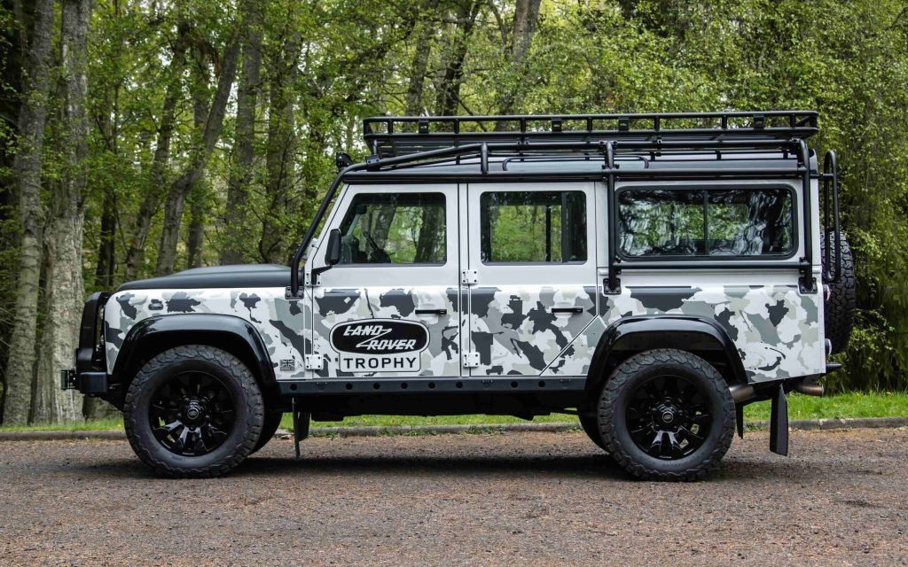 Land Rover Defender Works V8 Trophy II side view in forest