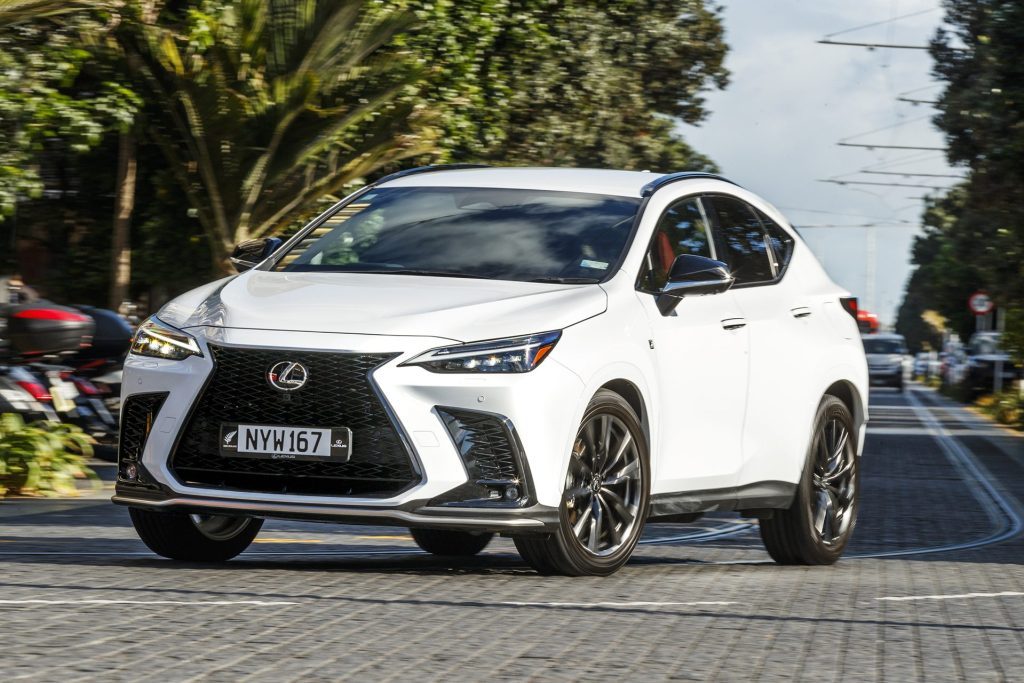 2022 Lexus NX 450h+ F Sport driving through city streets