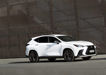 2022 Lexus NX 450h+ F Sport parked in front of metal wall