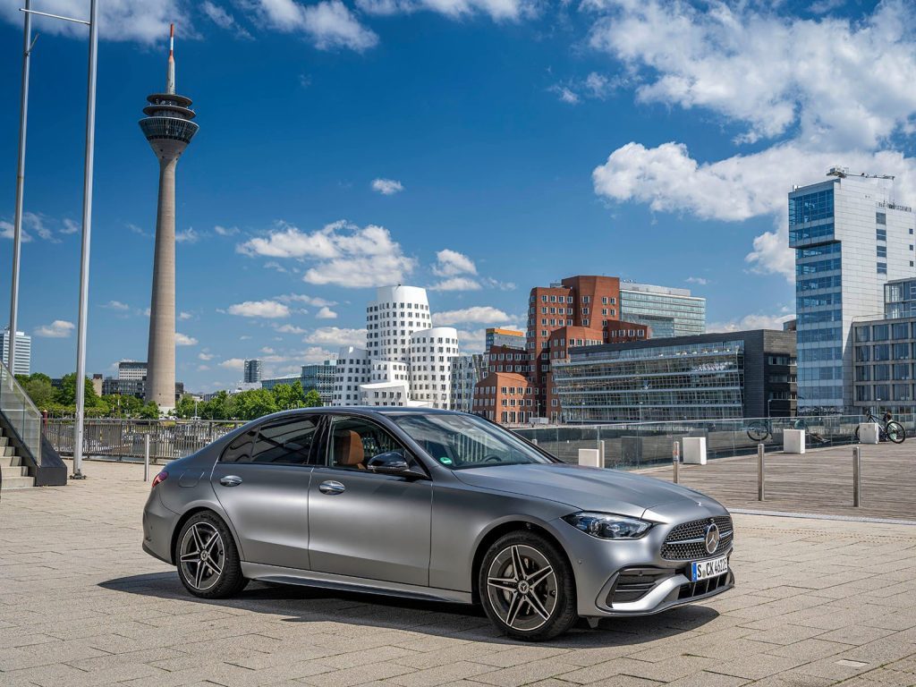 Mercedes-Benz C-350 e plug-in with city skyline in background