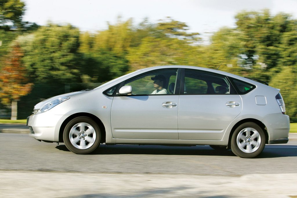 2004 Toyota Prius II driving past trees