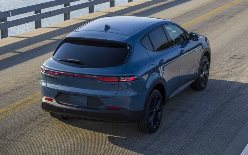 Dodge Hornet rear three quarter view driving on bridge