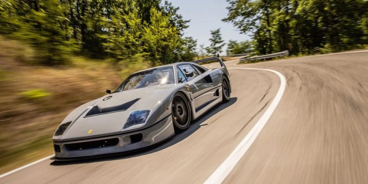 One-off Ferrari F40 Competizione front three quarter view driving around corner