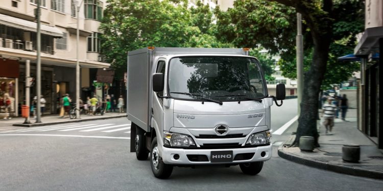 Hino 200 Series front three quarter view in town