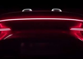 MG electric roadster tail lights illuminated in darl