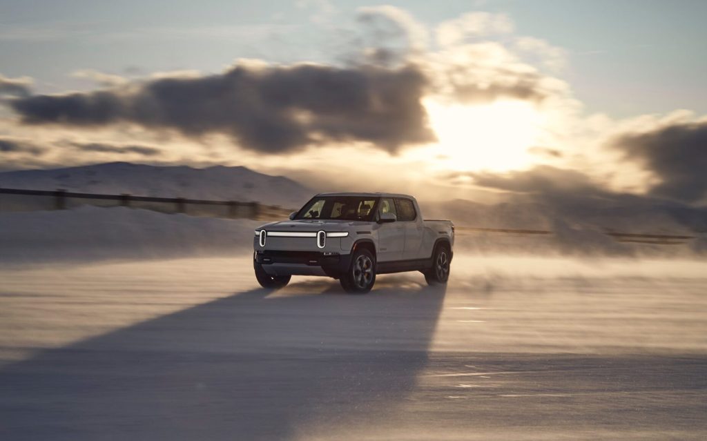 Rivian R1T front three quarter view drifting on snow