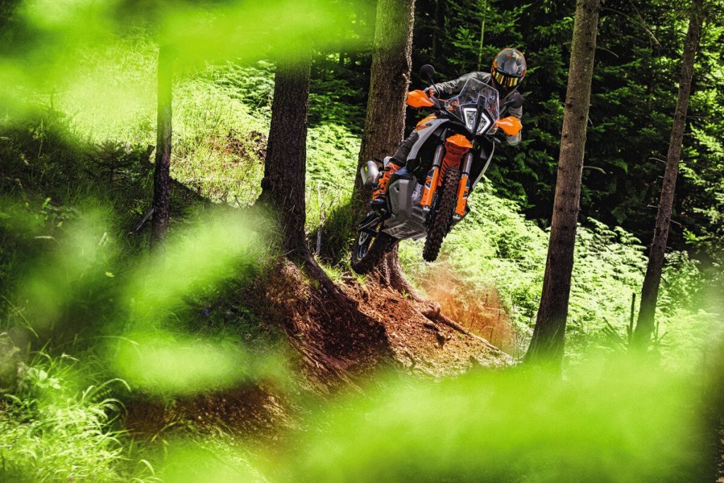 KTM 890 Adventure R jumping off of hill