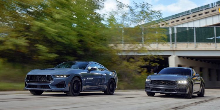 Ford Mustangs racing on road