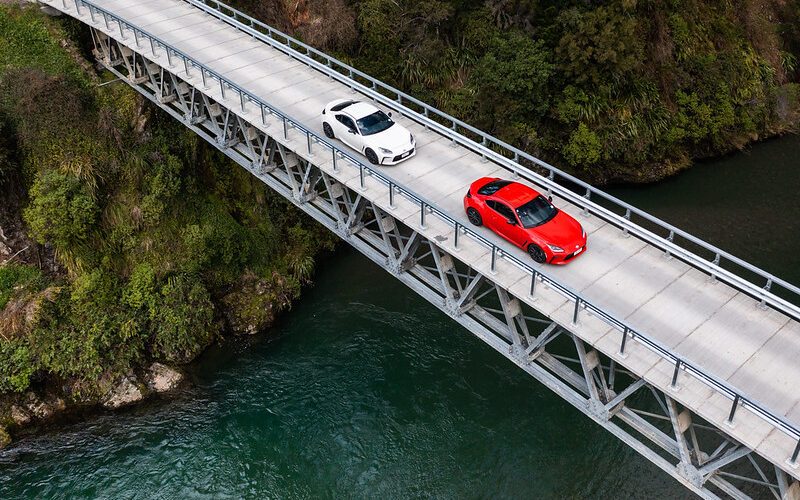 Toyota GR86 pair driving over bridge