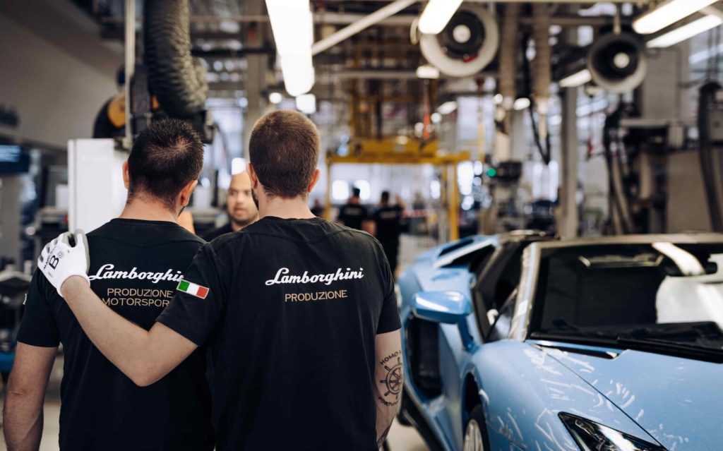 Last Lamborghini Aventador on production line with two workers