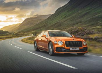 Bentley Flying Spur Speed front three quarter view driving on road