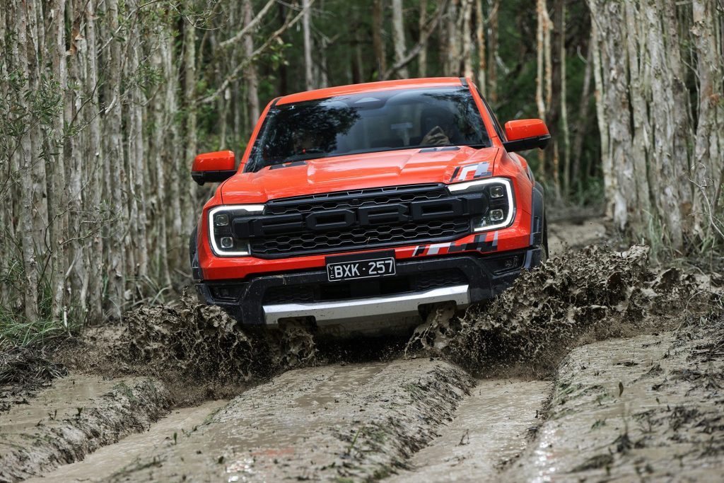 2022 Ford Ranger Raptor driving through mud and ruts