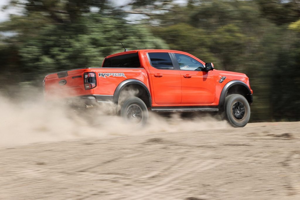 2022 Ford Ranger Raptor driving fast on dusty road