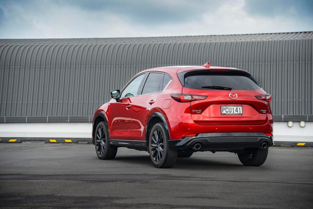 2022 Mazda CX-5 SP25T parked in front of corrugated iron wall