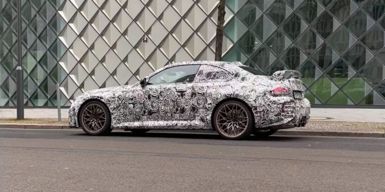 BMW M2 in camouflage side view