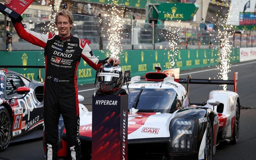 Brendon Hartley holding Le Mans Hyperpole trophy