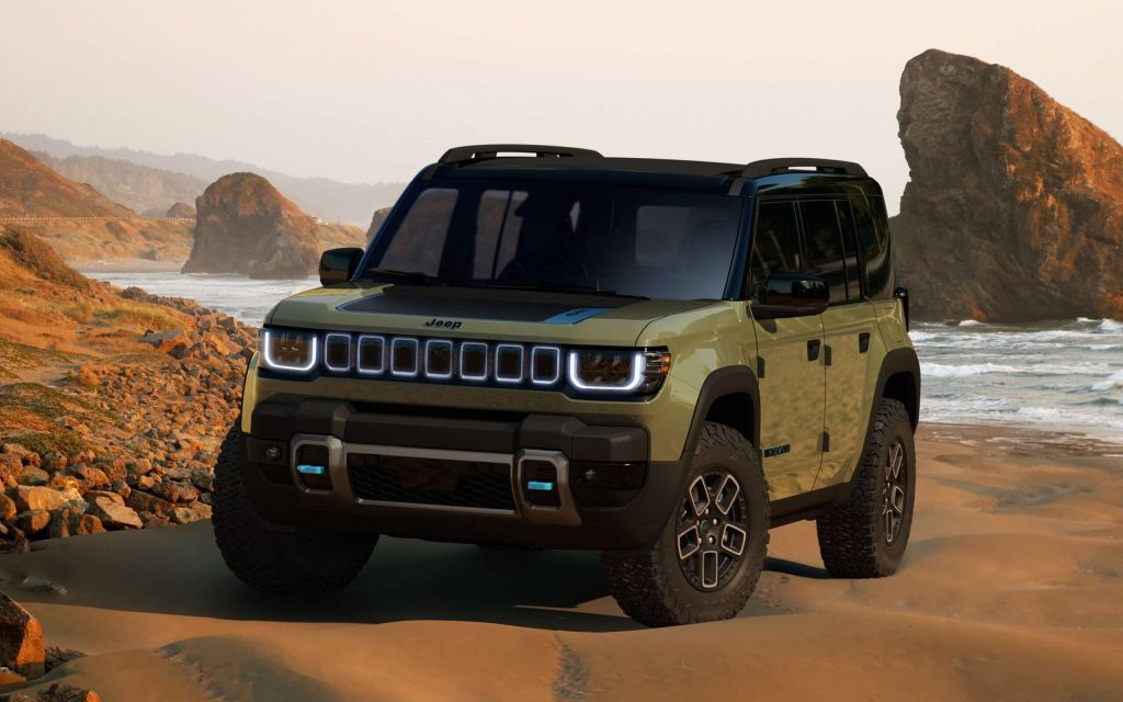 Jeep Recon 4xe SUV front three quarter view on beach