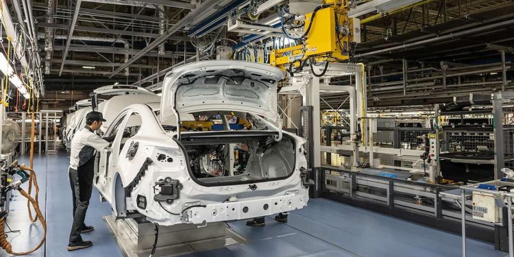 Mazda manufacturing plant with person on production line