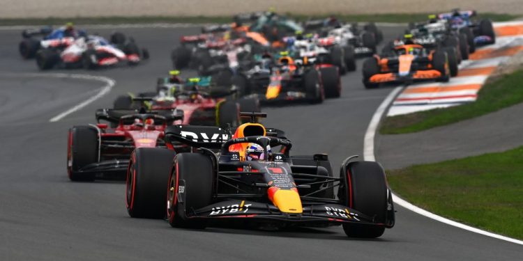 Formula 1 cars racing with Max Verstappen Red Bull leading