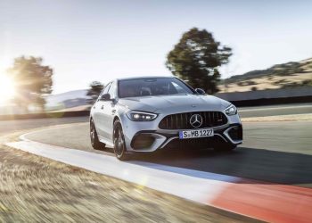 Mercedes-AMG C 63 E Performance front three quarter view driving on track