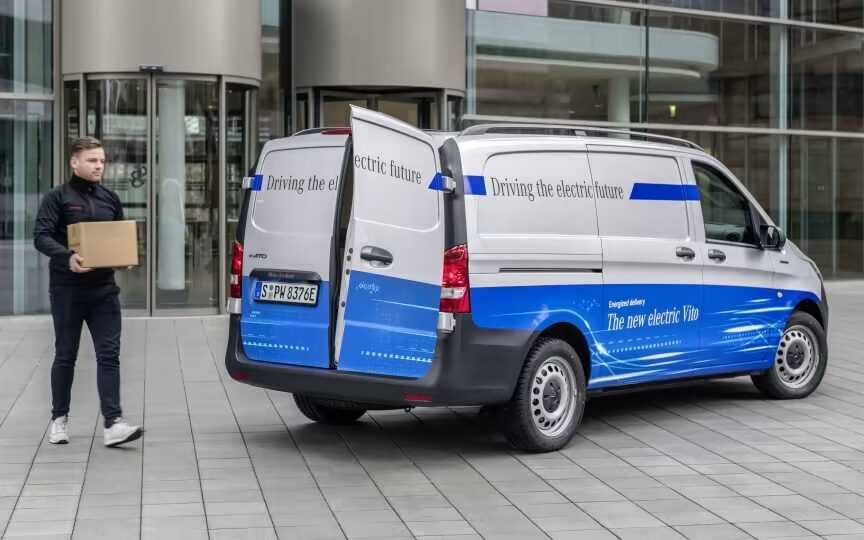 Mercedes-Benz eVito Panel Van rear three quarter view with man loading box