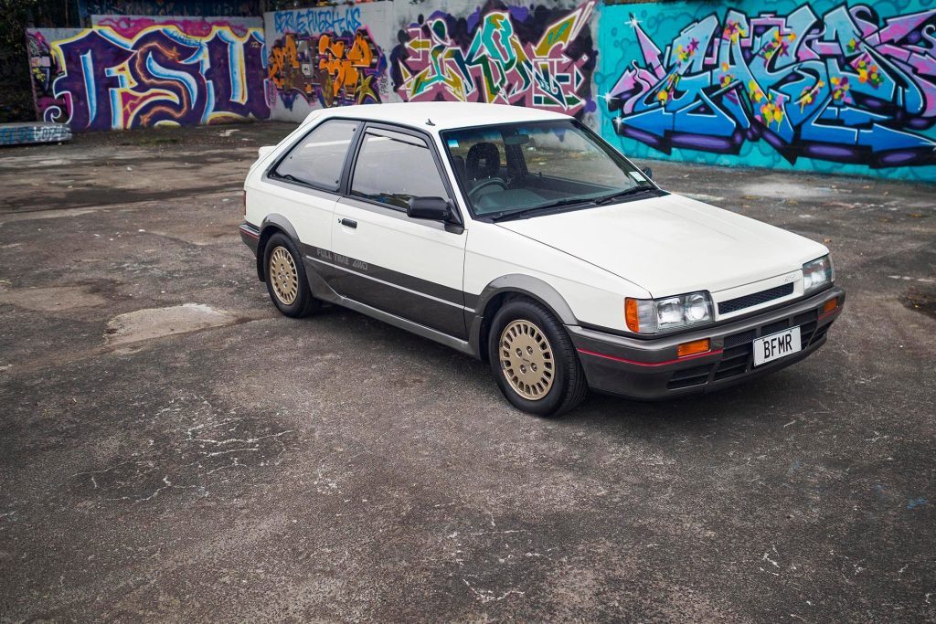 1986 Mazda Familia 4x4 DOHC Turbo in grungy car park