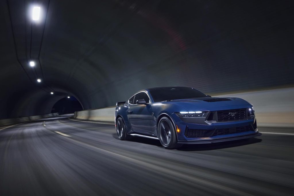 Ford Mustang Dark Horse driving through tunnel front view