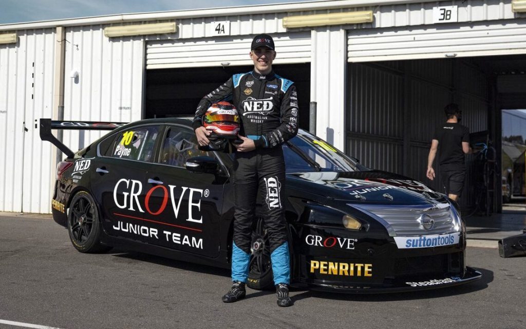 Matthew Payne standing in front of Nissan Altima Super2 car