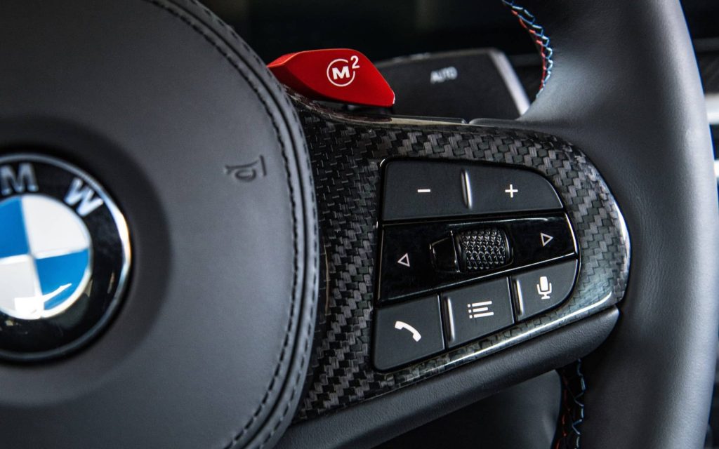 BMW M2 steering wheel buttons close up view