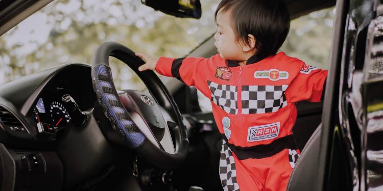 little kid driving car