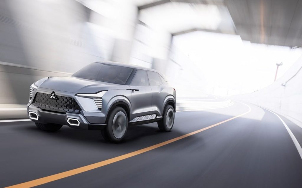 Mitsubishi XFC Concept render front three quarter view driving