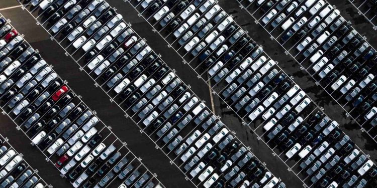 New cars waiting in line bird's eye view